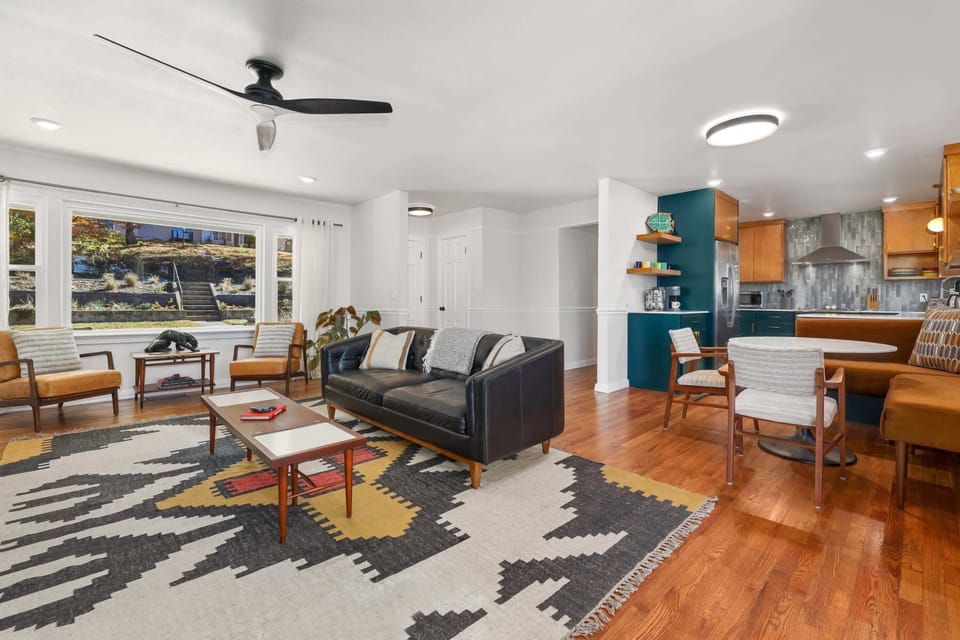 Our main living area features large windows, plush seating, and a Smart TV.