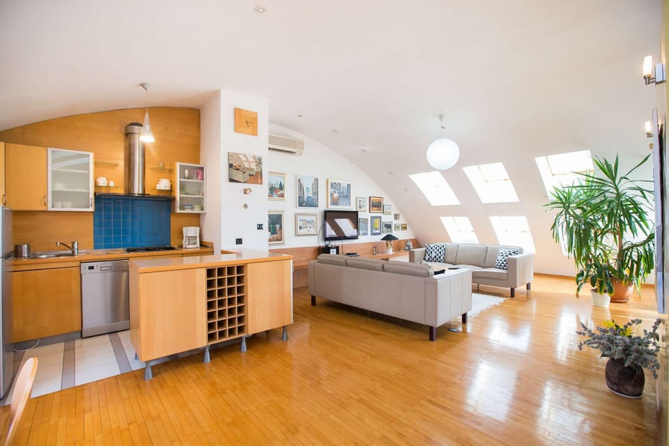 Fully equipped kitchen and living room sitting area.
