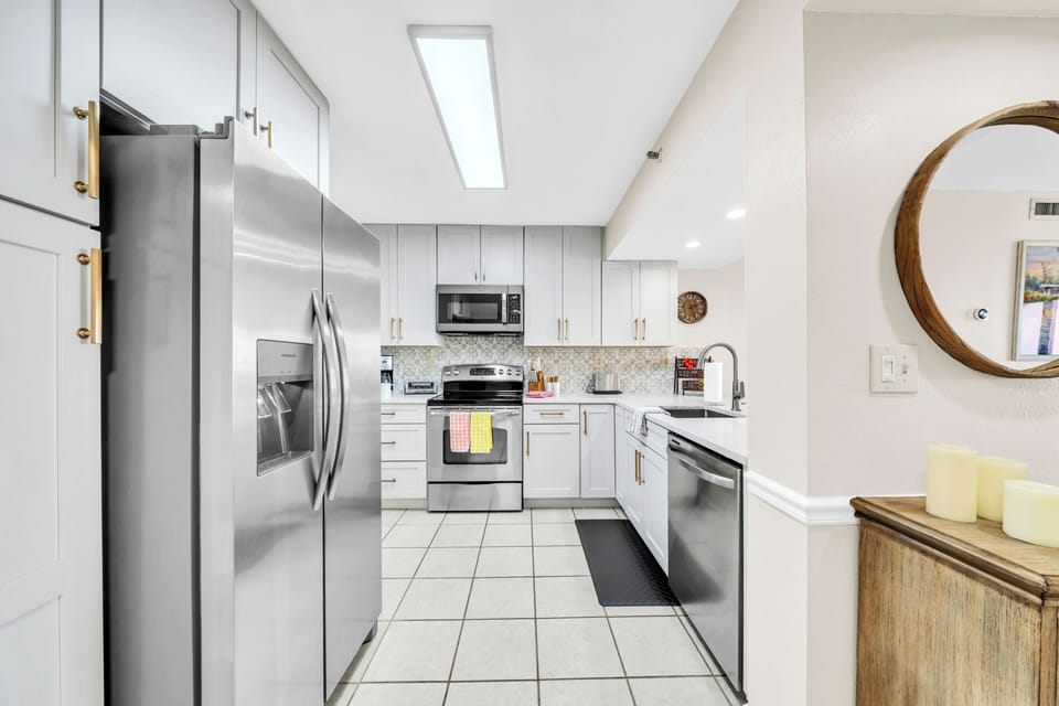 Your bright, modern kitchen awaits with stainless steel appliances and plenty of counter space for cooking memorable meals together.