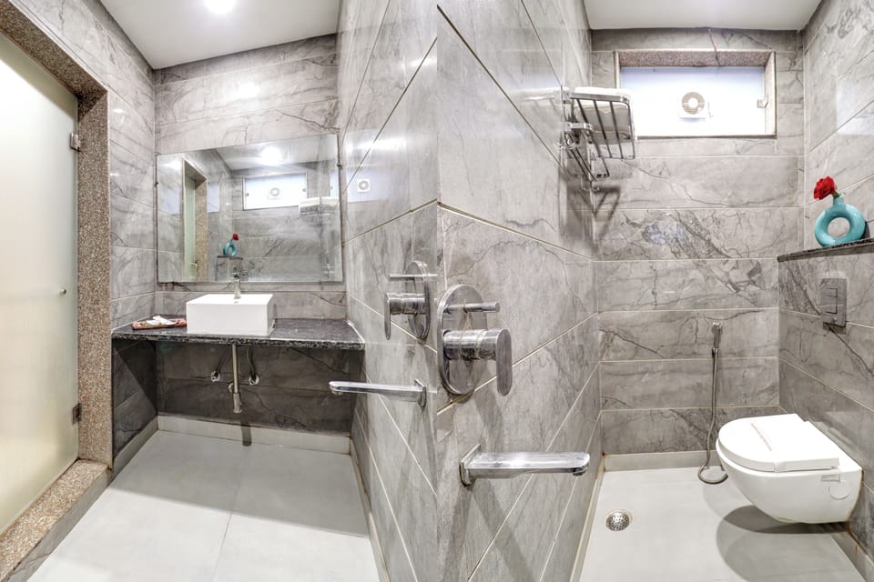 Shower, designer toiletries, bathrobes, slippers