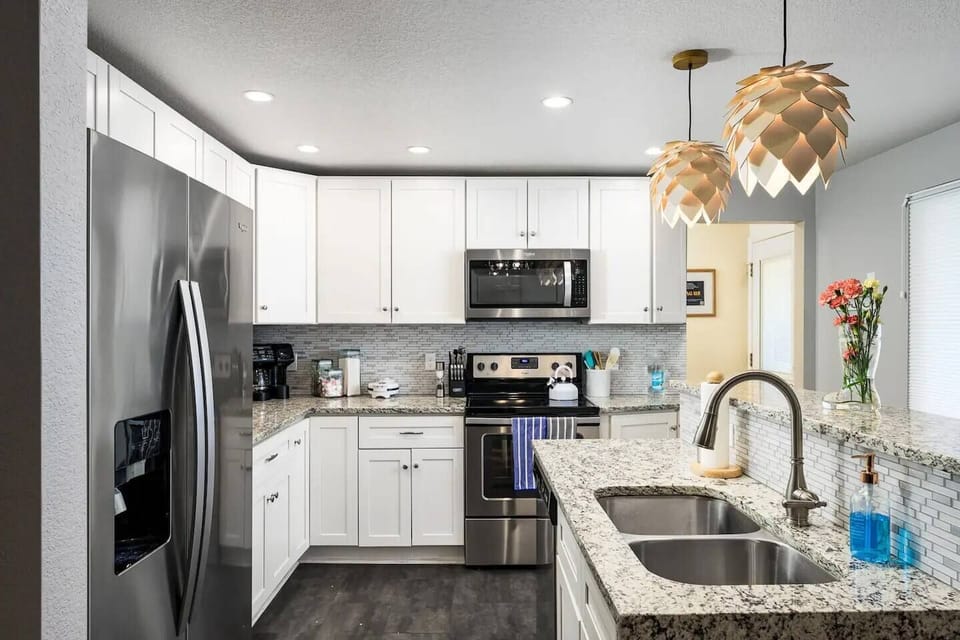 Fully stocked large kitchen featuring Hop Lighting & a Coffee/ Breakfast Station which includes:- Waffle Maker & Mix- Assorted Coffee + Flavors/Sweetners/Creamer- Assorted Tea s- Cookware ++- Seasonings