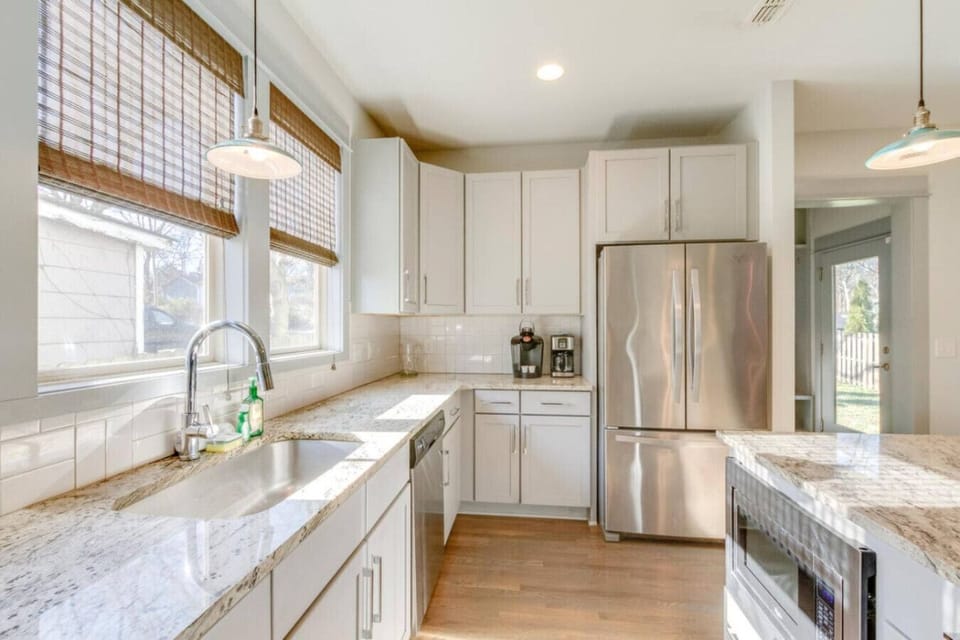 A kitchen angle showing the full countertop layout and stainless appliances.