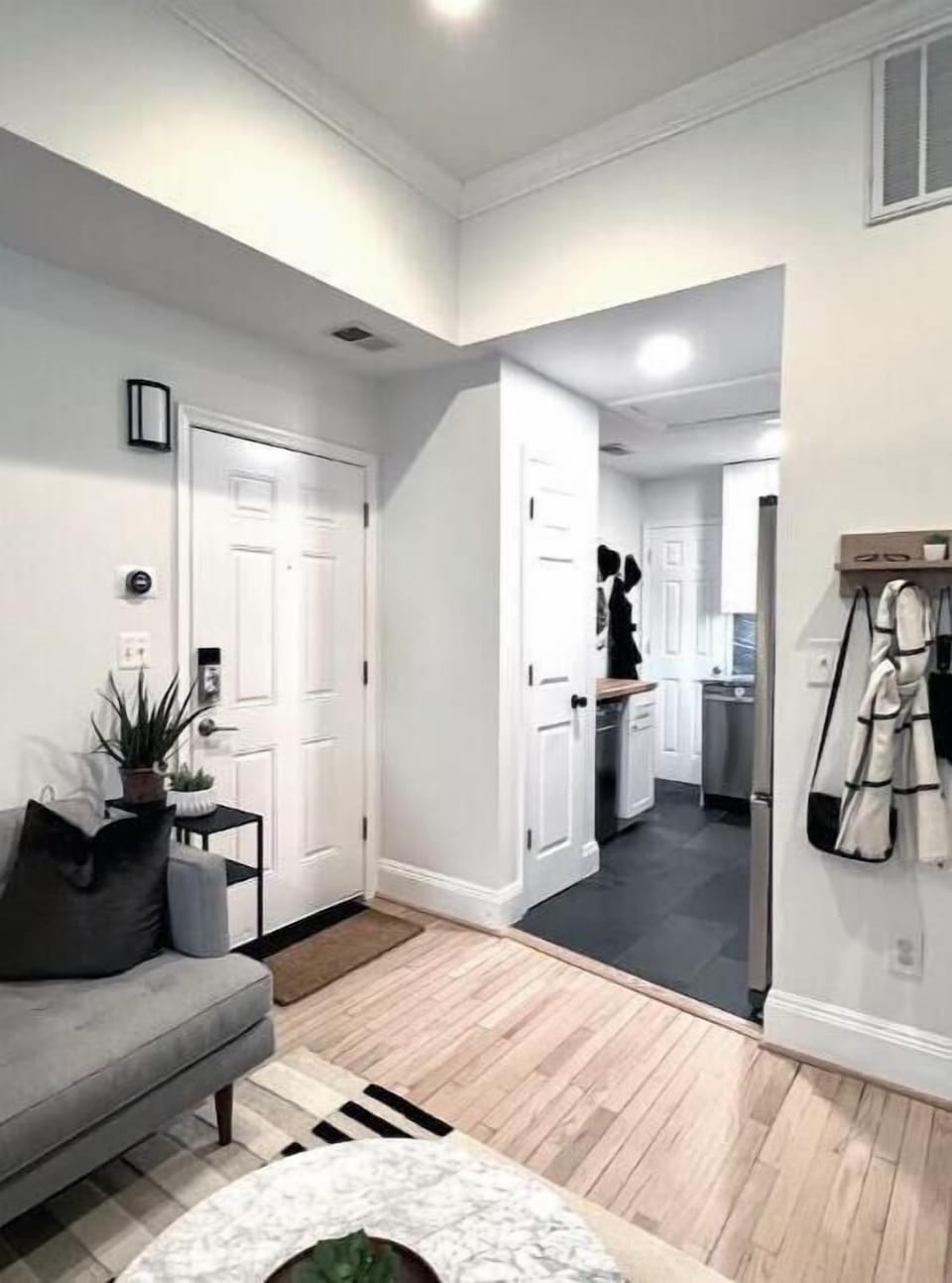 The keypad coded entry is situated between the updated kitchen and living room.