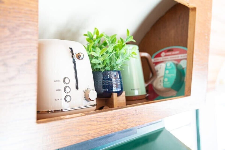 Enjoy your breakfast inside the cozy trailer, microwave, tea kettle, toaster, and fridge are all provided. 