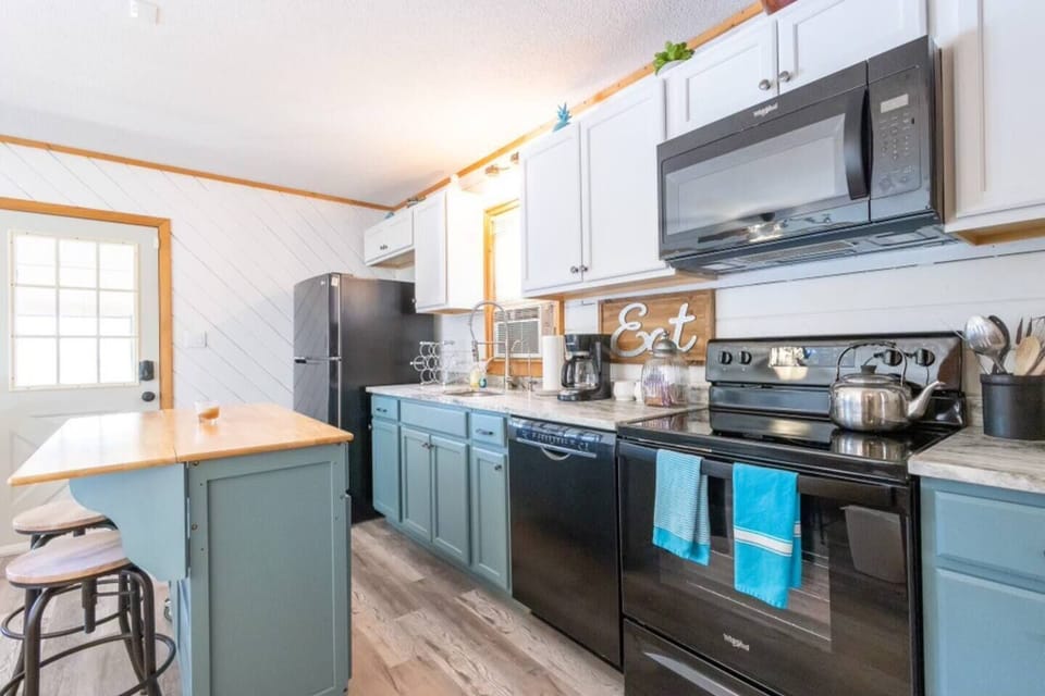 Another view of the kitchen including a close up of the all new appliances.