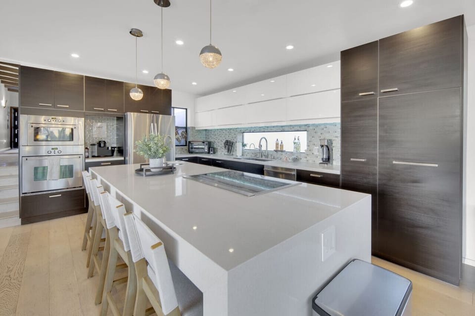 Kitchen Paradise: Gather around the stunning island and whip up culinary delights with style!