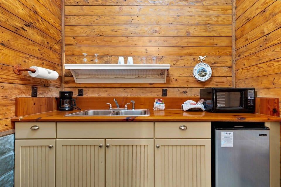Whip up a snack or simple meal in the well-equipped kitchenette featuring counter space, sink, mini fridge, and microwave.
