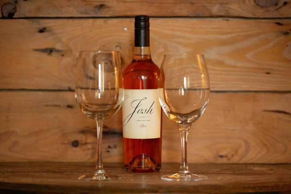 Pick of a bottle in Gruene and unwind with a glass of wine on the charming front porch, offering serene views and relaxation.