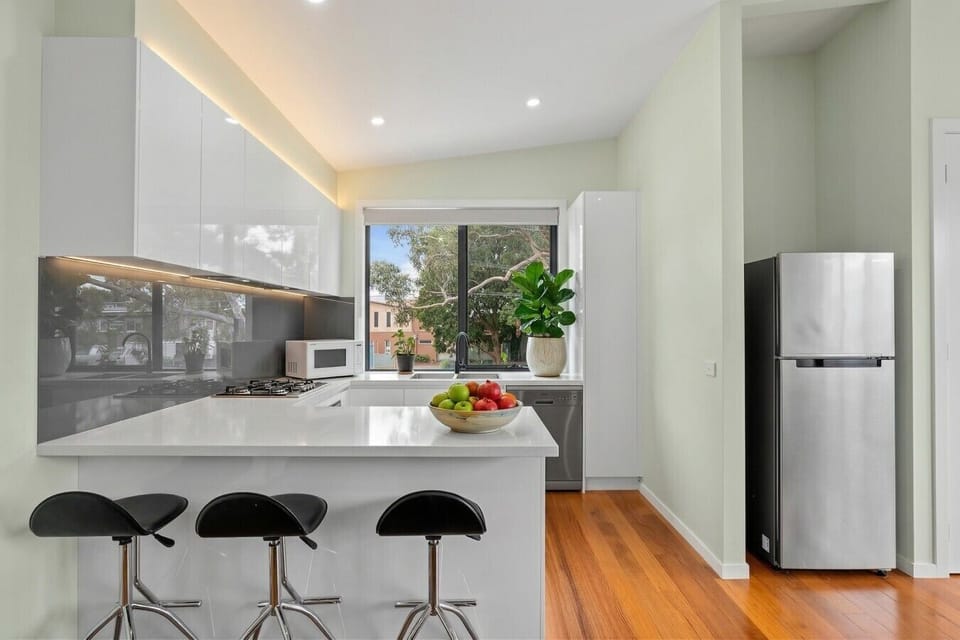 Premium appliances including full-size refrigerator, stove, and microwave