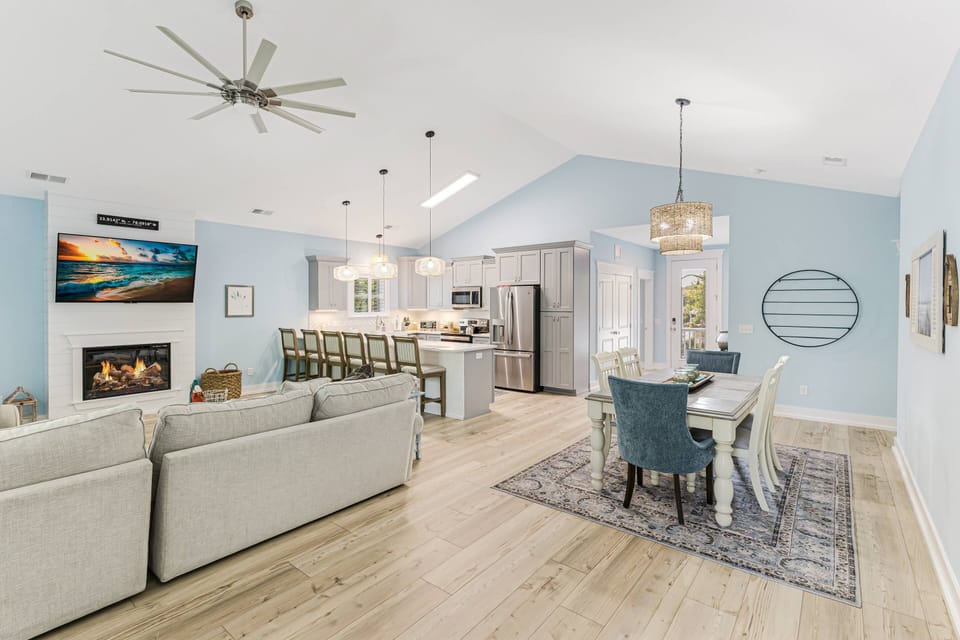 The open concept living room/kitchen/dining areas keep everyone together while engaged in their own activities.