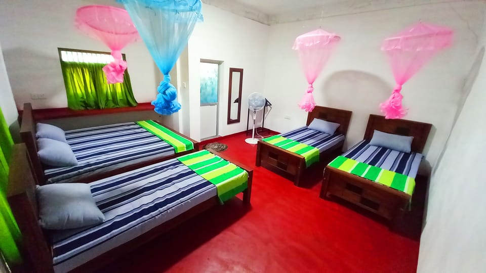 Family Quadruple Room | Desk, blackout drapes, iron/ironing board