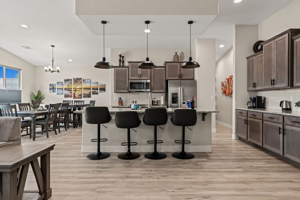Gather in the kitchen with comfy bar seating.