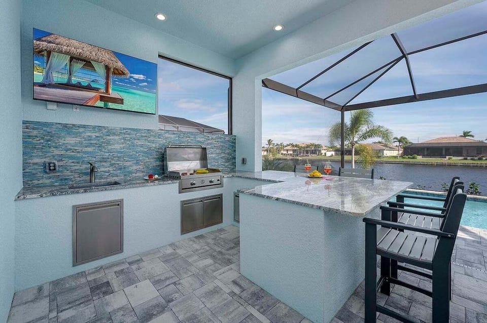 Outdoor Kitchen (Built in BBQ is not available for guest) Gusts are provided with a stand alone BBQ with TV