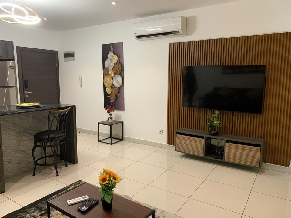 Luxury Apartment, 1 Bedroom, Garden View | Living area | 42-inch TV with satellite channels