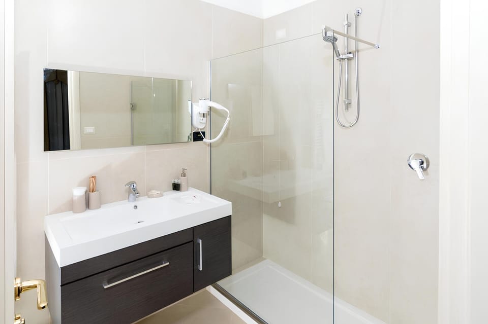 Designer toiletries, hair dryer, bathrobes, slippers