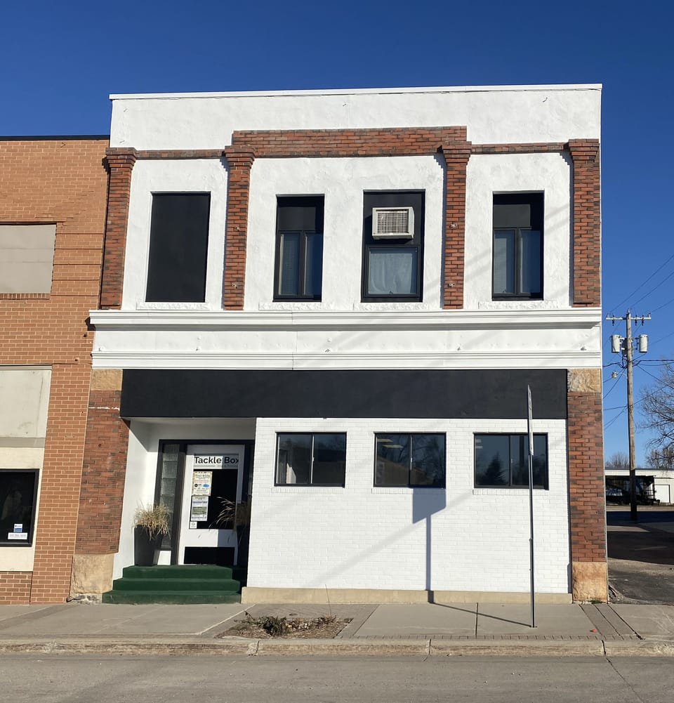 Tackle Box Loft is located on the second floor. Entrance from alley or main st.