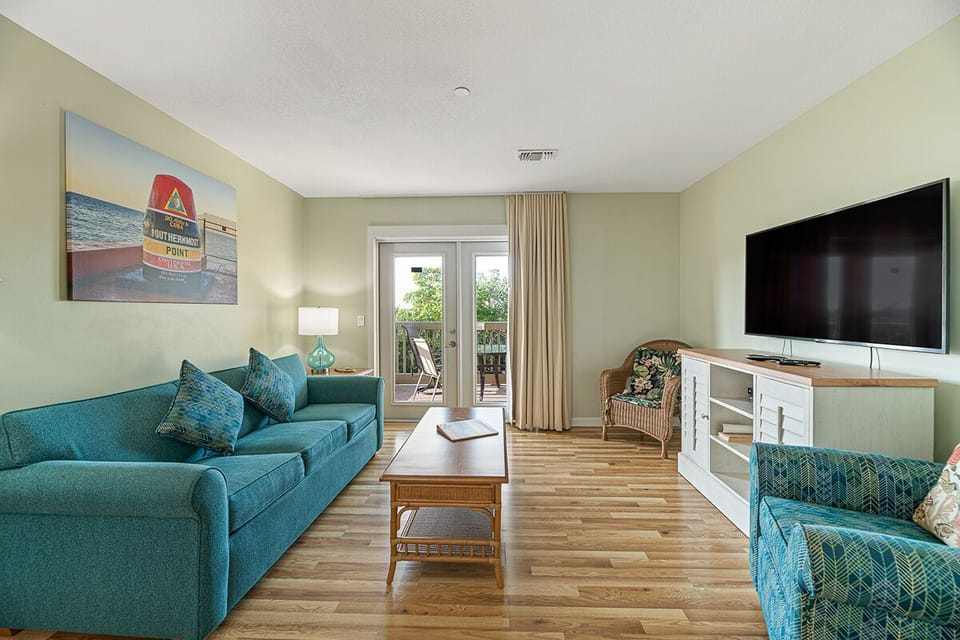 Condo | Living area | 32-inch Smart TV with satellite channels