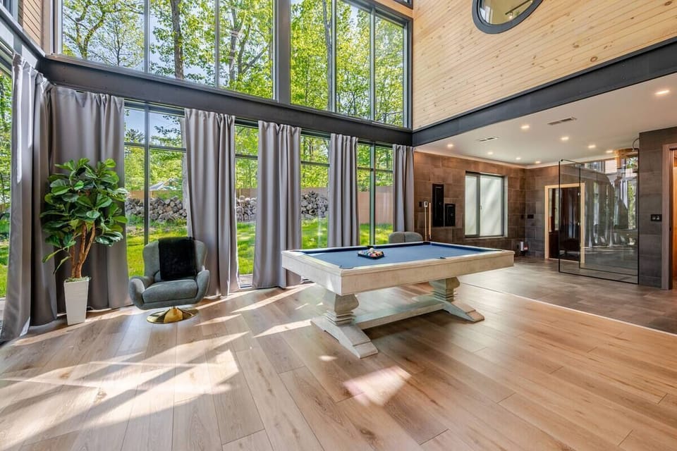 A stylish game room featuring a pool table, perfect for friendly competition.