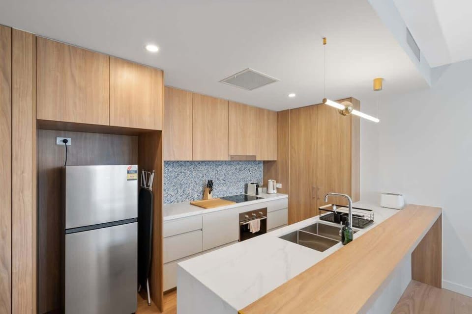 Brand new unit with loads of luxury features including the double sink, breakfast bar and the LED pendant light