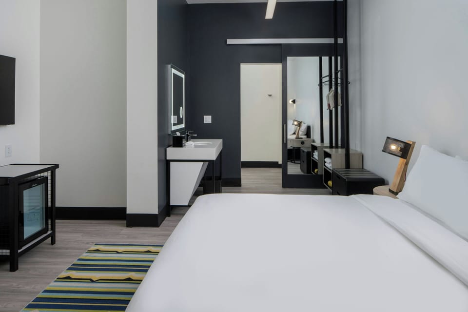 Premium bedding, pillowtop beds, laptop workspace, blackout drapes