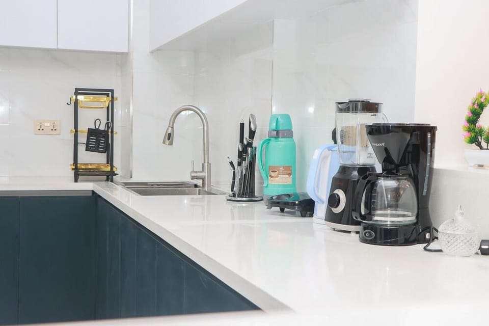 Fridge, microwave, cookware/dishes/utensils, dining tables