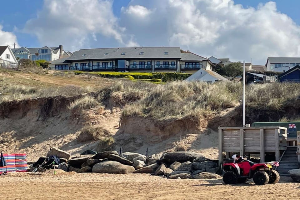 Be at the sandy beach in a two minute walk!  Here's a view of the apartment from the beach over the dunes