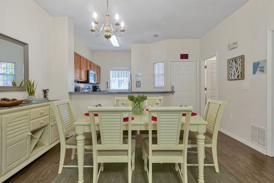 Gather for breakfast, dinner, or takeout in a welcoming dining area connected to the kitchen and living space