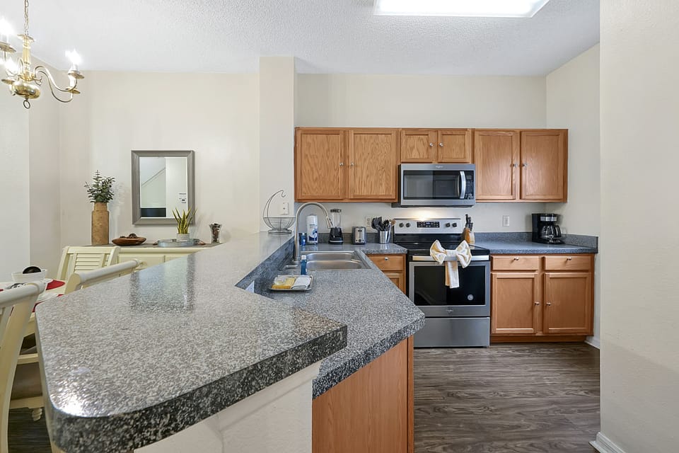 Experience the perfect blend of functionality and cleanliness in this impeccably organized, fully stocked kitchen.