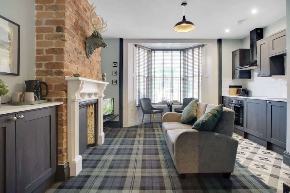 Spacious living room equipped with a SMART TV with Netflix, an indoor fireplace with ample seating to sit down & relax. 