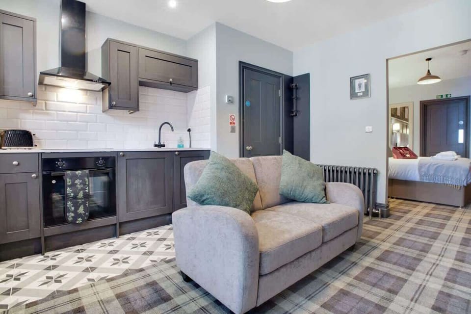Spacious living room equipped with a SMART TV with Netflix, an indoor fireplace with ample seating to sit down & relax. 