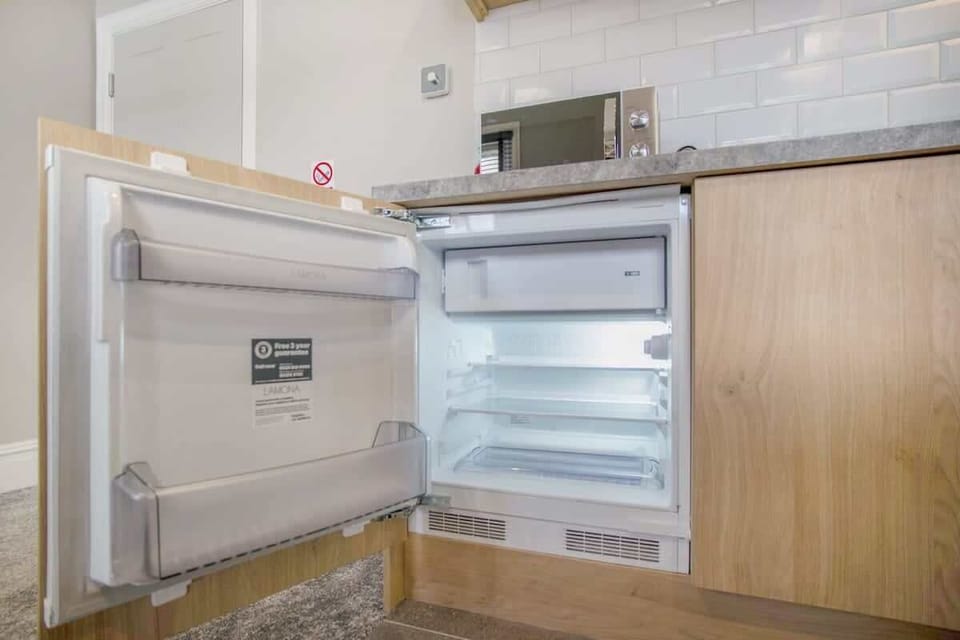 Kitchen equipped with all essentials, including a washer & dryer, oven, fridge and full cookware set.