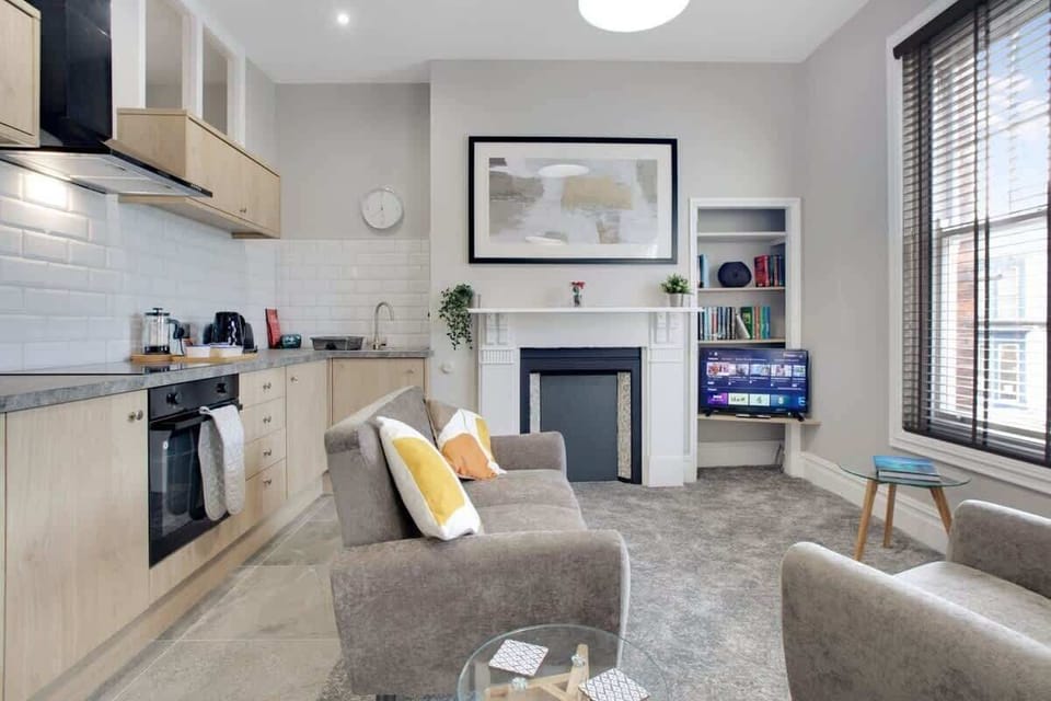 The open-plan living, dining, and kitchen area offers plenty of room to unwind. Enjoy cosy evenings by the indoor fireplace or settle in with the Smart TV after a day of exploring.