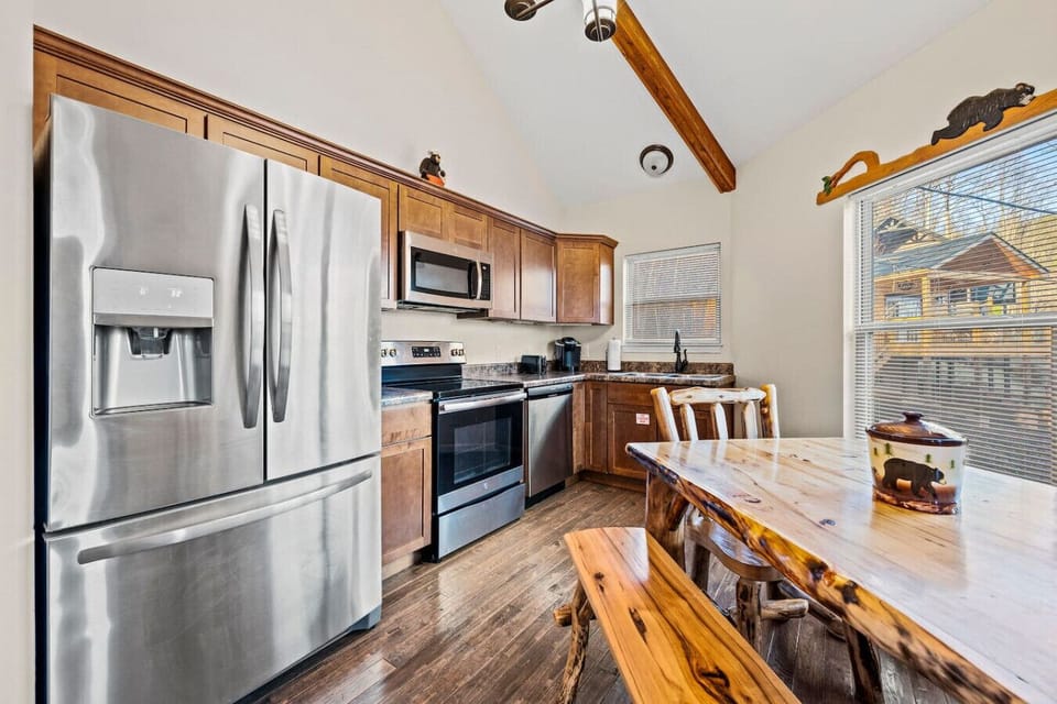 The kitchen has a suite of stainless steel appliances and is fully stocked for the aspiring chef in your group.