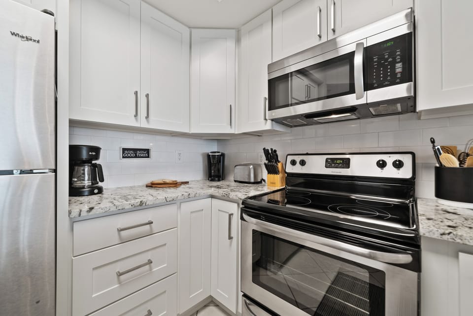 Full Kitchen with appliances and cooking essentials
