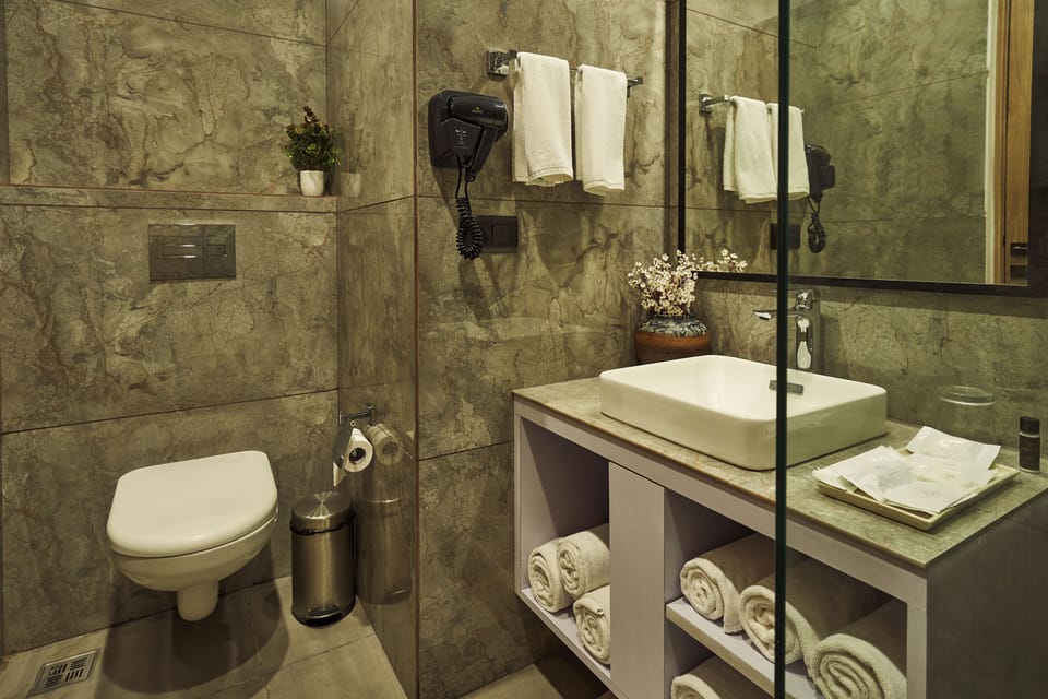 Shower, rainfall showerhead, designer toiletries, hair dryer
