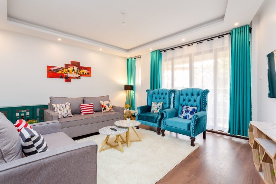 Deluxe Apartment | Living area | 24-inch Smart TV with digital channels