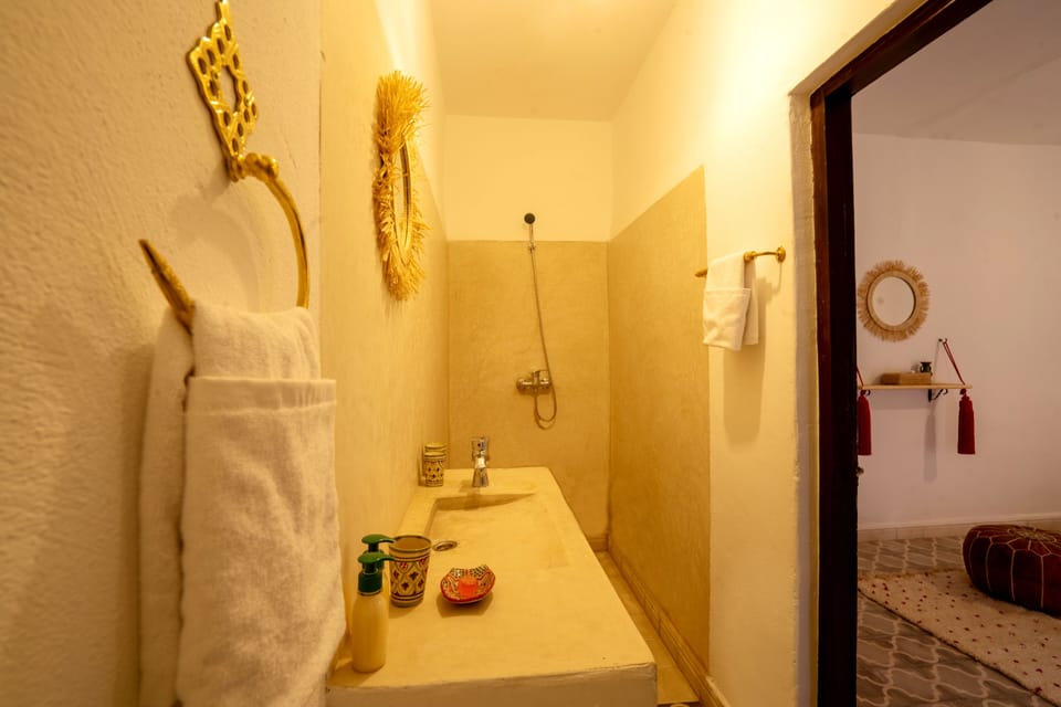 Shower, designer toiletries, towels, soap