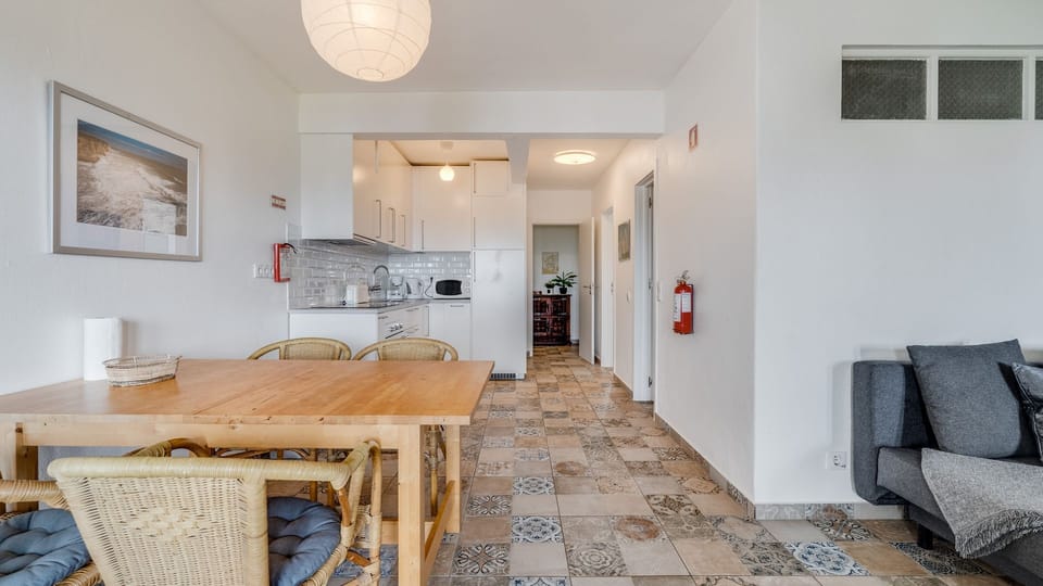 Enjoy the convenience of a well-equipped bathroom, complete with a modern vanity and essential amenities, designed for your comfort and ease.