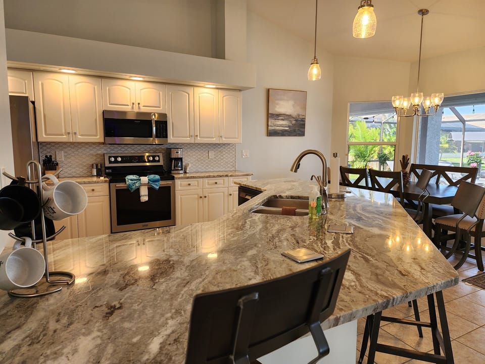 Kitchen with view of the lake & pool