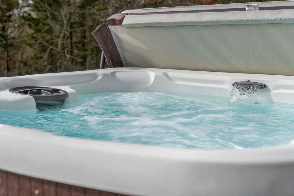 Relax and recharge in your private hot tub while enjoying peaceful lake views all around.
