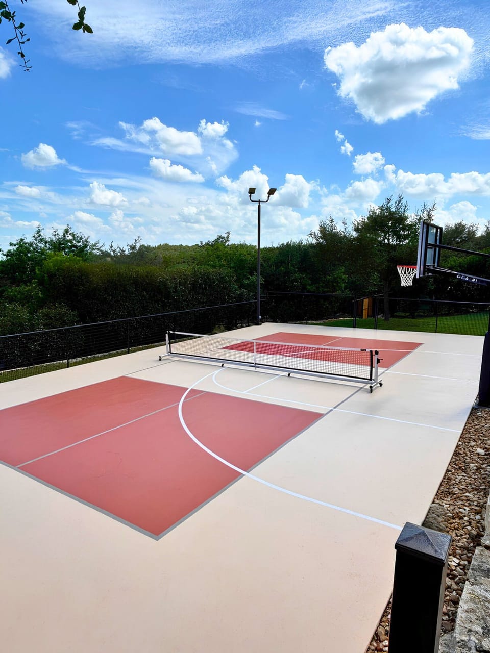 Private pickleball and basketball court with scenic outdoor views