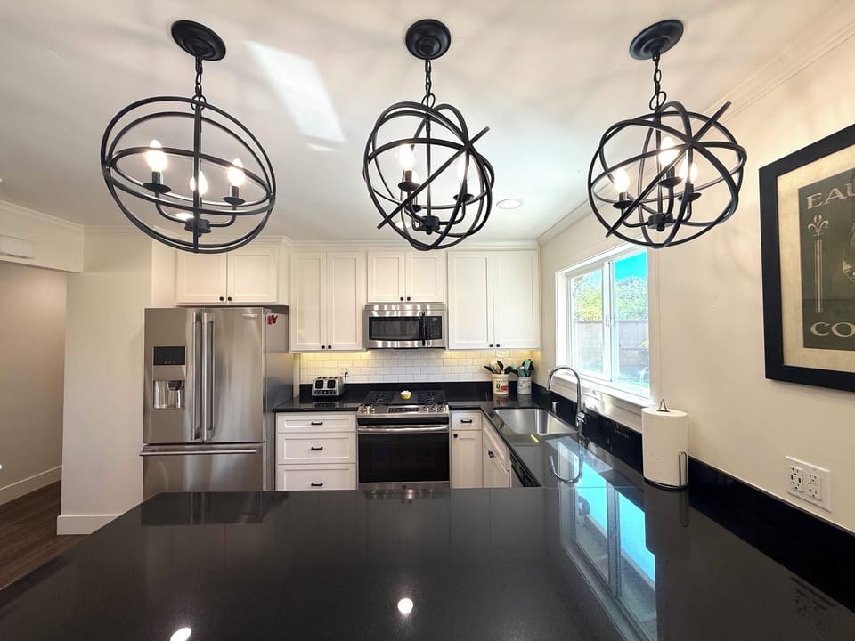 Three bar stools to sit at the kitchen peninsula