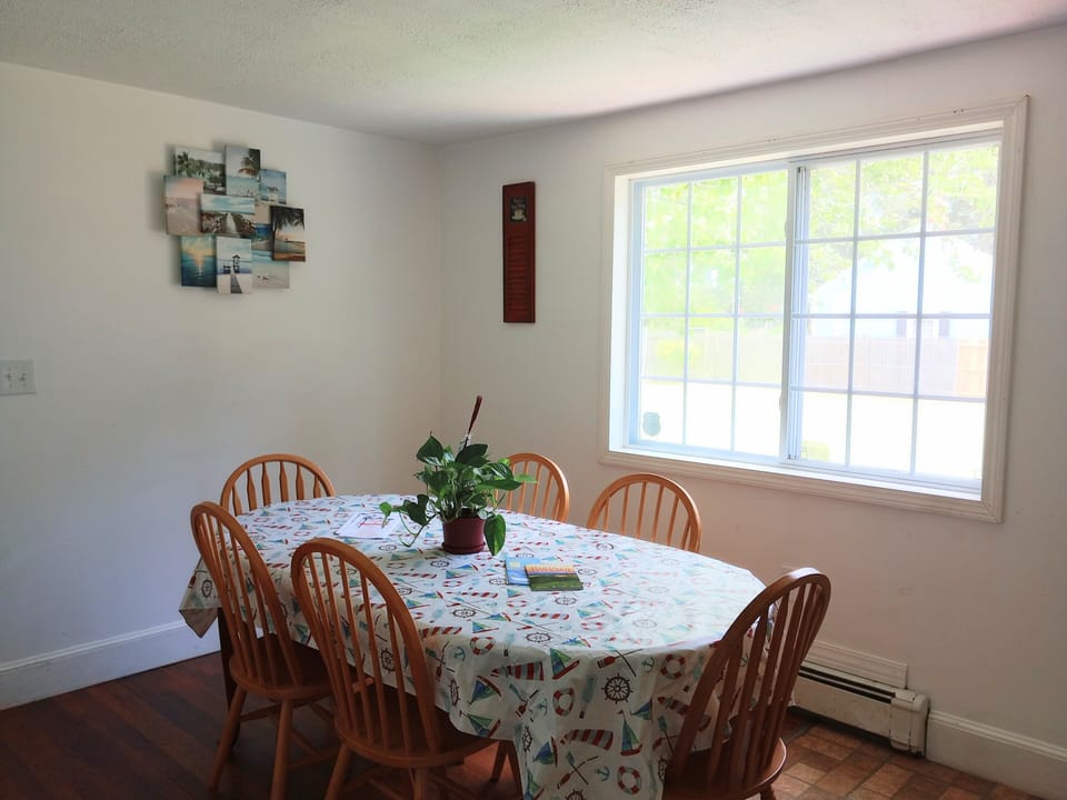 Dining Room overlooking the spacious private fenced in backyard w/ Guest house!