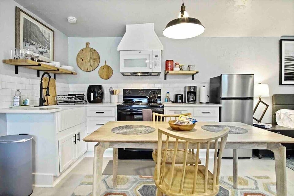The kitchen is well-designed with a dining area and a clean, spacious layout