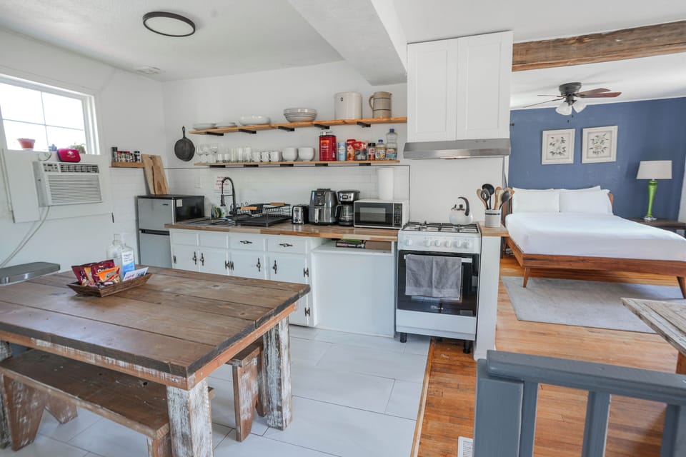 Cozy cabin kitchen with all the amenities you need to cook up a storm. Enjoy a home-cooked meal in a warm and inviting atmosphere.