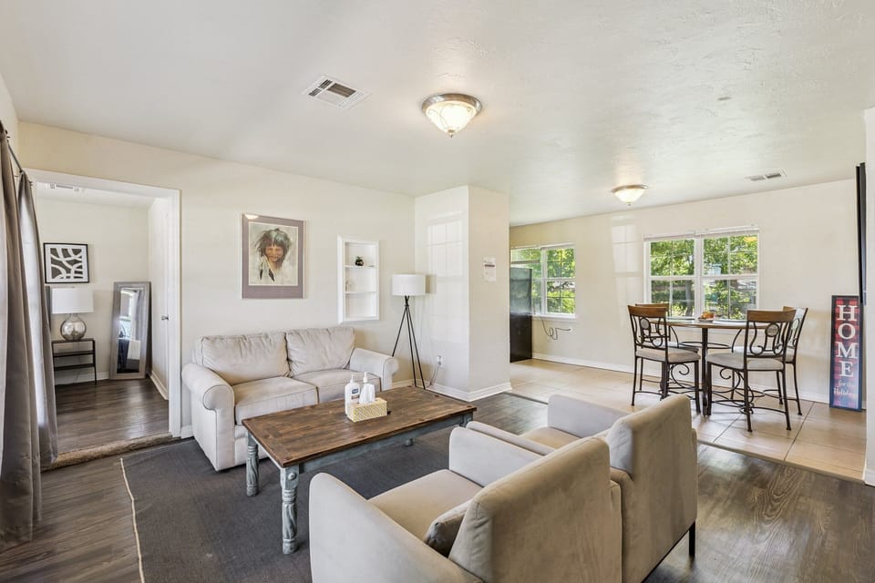 This open-concept layout connects the living area with a sunny dining nook—perfect for gathering, meals, or game night.