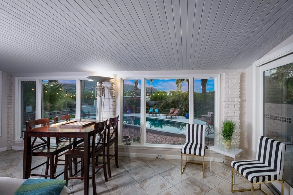 Game table area with views of the pool & outdoor patios.