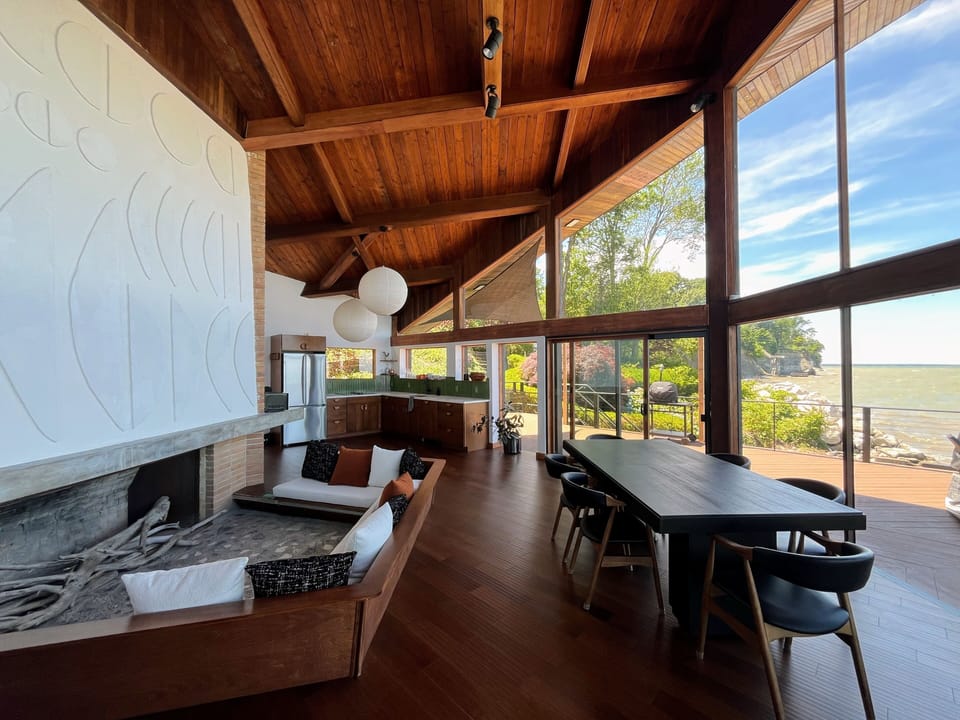 Conversation pit and dining table; kitchen behind (opposite living room)