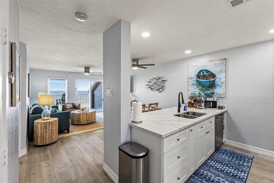 Bright, airy space with ocean art and stylish decor—perfect for relaxation
