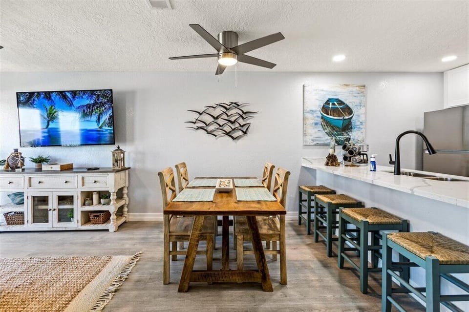 Gather around the rustic table and enjoy a vibrant coastal vibe!